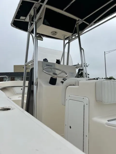 Slide: The Image of 2007 May-Craft 2300CC boat with center console and T-top, viewed from the deck. - 7