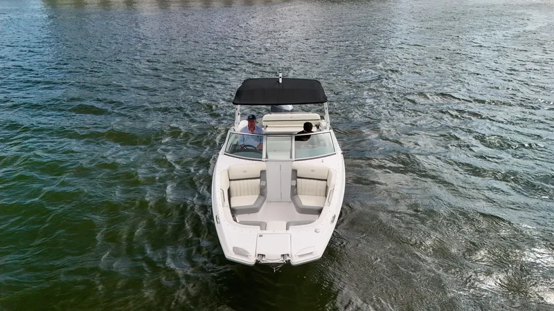 Slide: The Image of 2021 Cobalt 25SC boat cruising on open water, aerial view. - 22