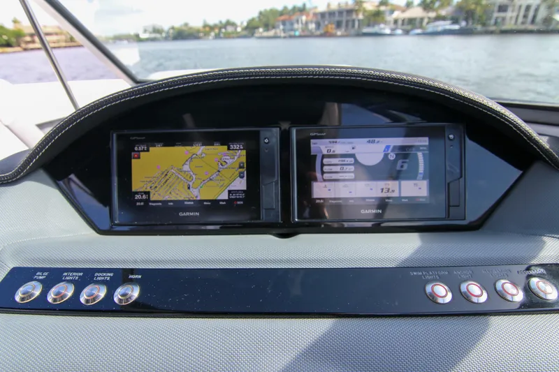 Slide: The Image of Dashboard of 2021 Cobalt 25SC boat with dual Garmin navigation screens. - 41