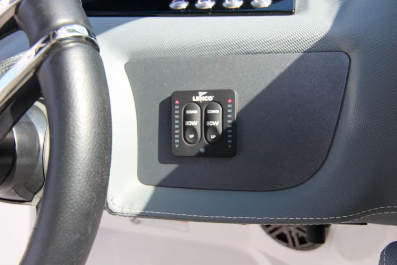 Slide: The Image of 2021 Cobalt 25SC boat dashboard with Lenco trim tab controls. - 45