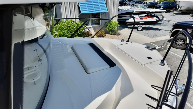 Slide: The Image of 2025 Bayliner Trophy 23 Pilothouse boat deck with seating and railing. - 13