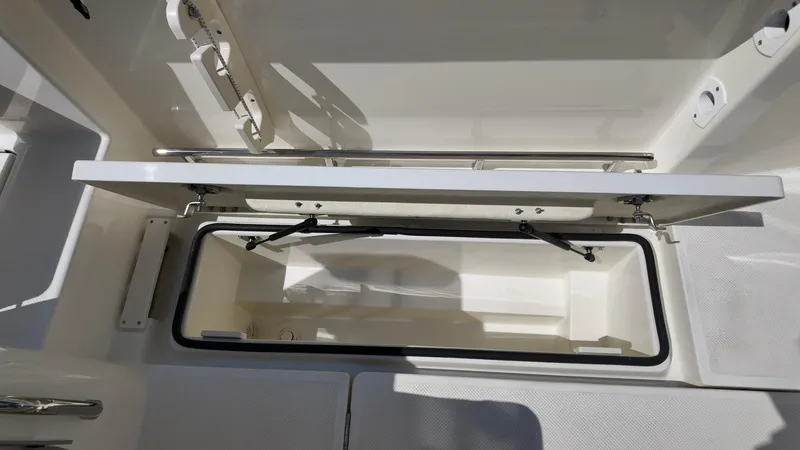 Slide: The Image of Open storage compartment on 2025 Bayliner Trophy 23 Pilothouse boat. - 16