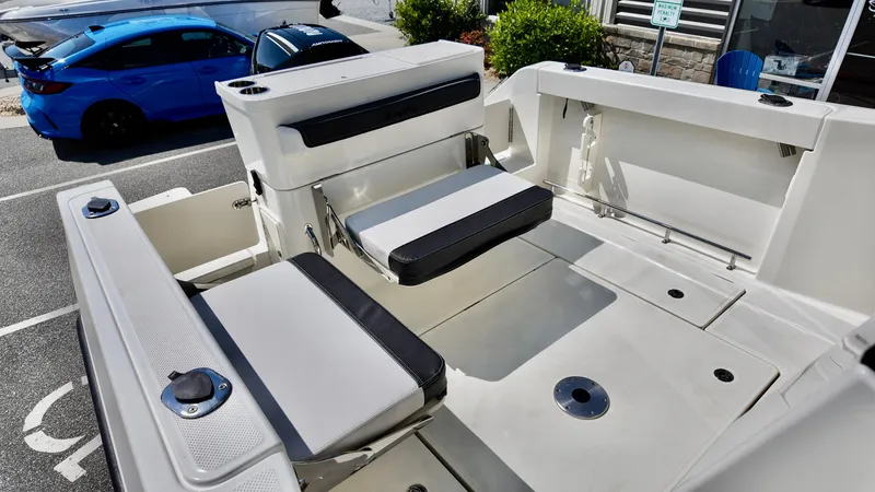 Slide: The Image of 2025 Bayliner Trophy 23 Pilothouse boat interior with seating and storage compartments. - 18