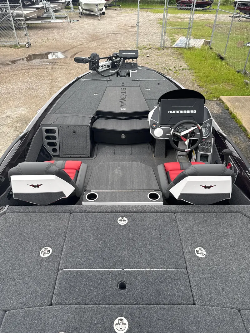 Slide: The Image of 2025 Vexus VXS20 boat interior with dual seats, steering console, and Humminbird electronics. - 23