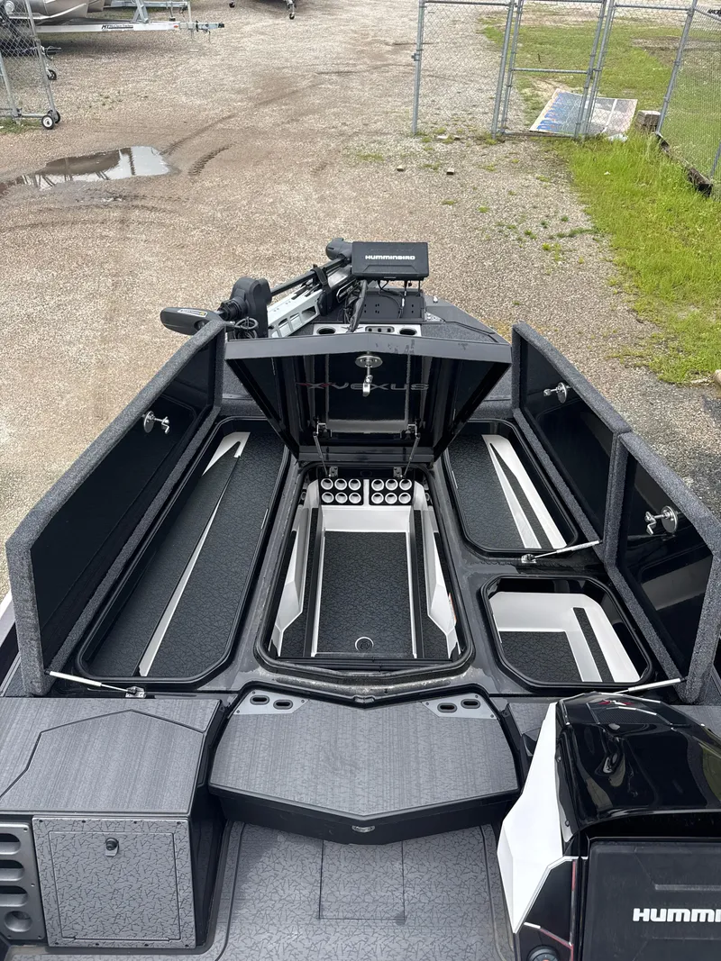 Slide: The Image of 2025 Vexus VXS20 boat interior with open storage compartments and advanced equipment. - 26
