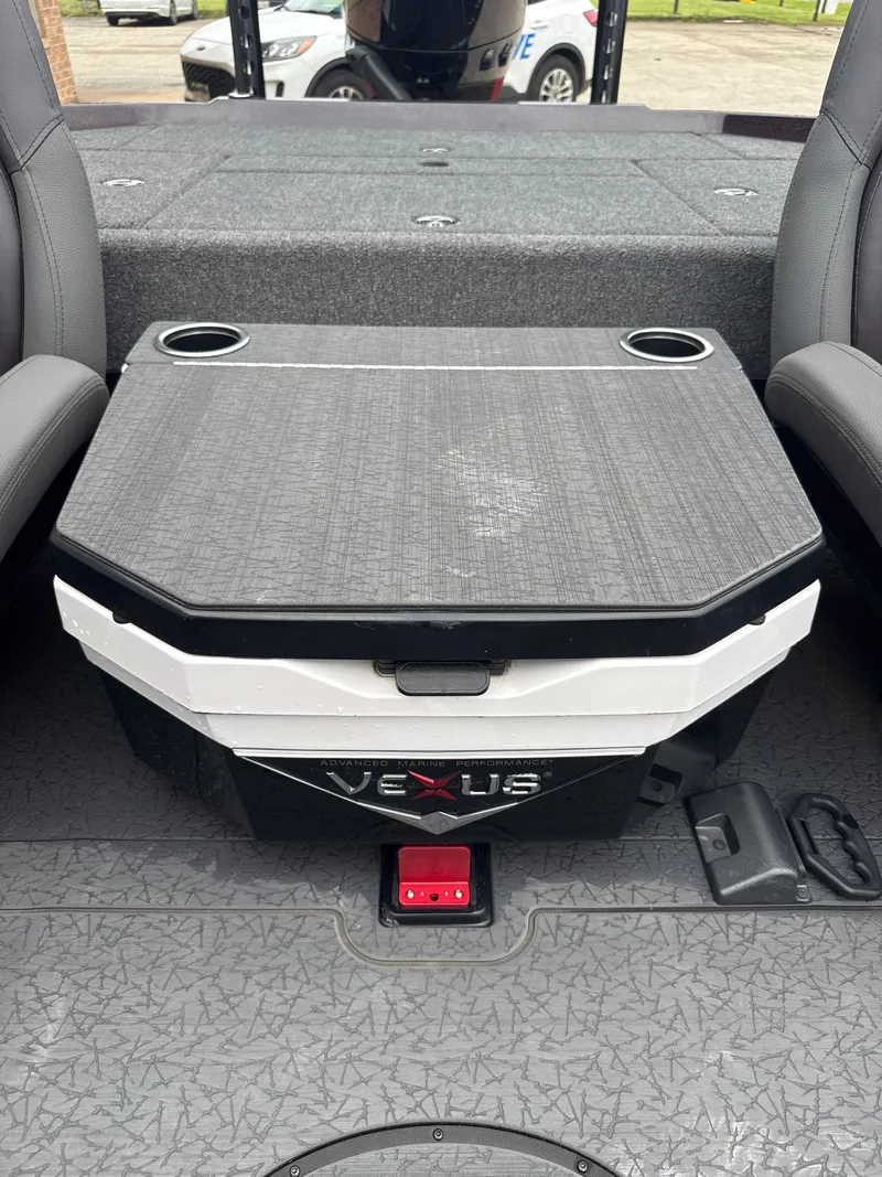 Slide: The Image of 2025 Vexus VXS20 boat interior with storage compartment and cup holders. - 27