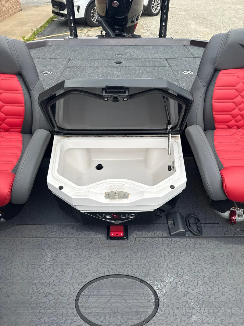 Slide: The Image of 2025 Vexus VXS20 boat interior with open storage compartment and red seats. - 28