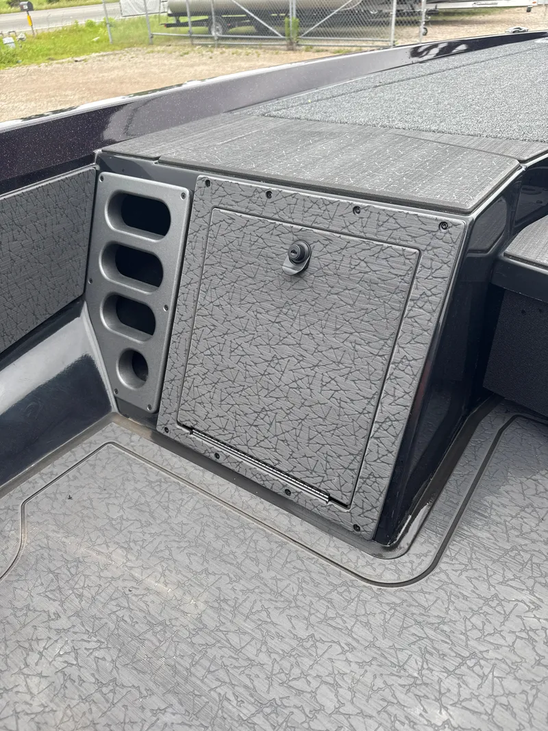 Slide: The Image of 2025 Vexus VXS20 boat storage compartment with textured surface and multiple slots. - 29