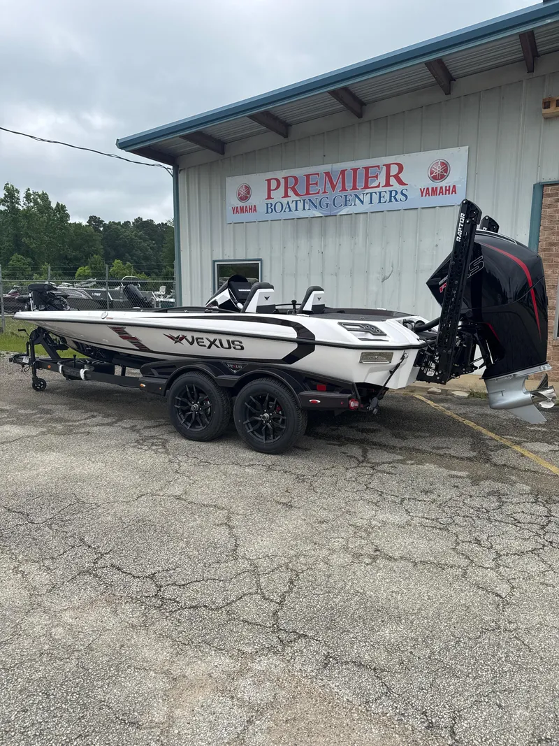 Slide: The Image of 2025 Vexus VXS20 boat on trailer at Premier Boating Centers, Yamaha signage visible. - 3