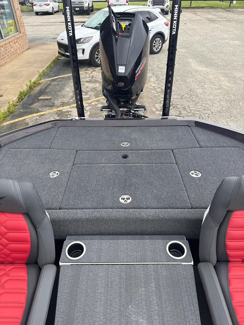 Slide: The Image of 2025 Vexus VXS20 boat interior with red seats and Minn Kota motor. - 31