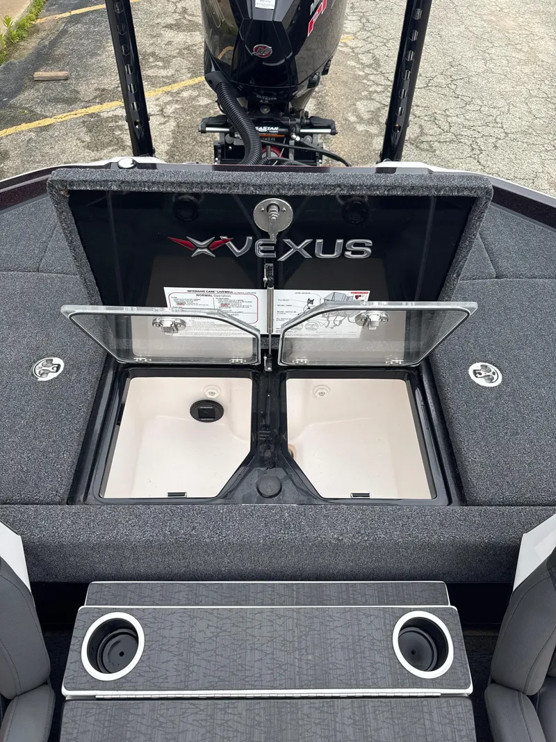 Slide: The Image of 2025 Vexus VXS20 boat interior with open storage compartments and cup holders. - 33