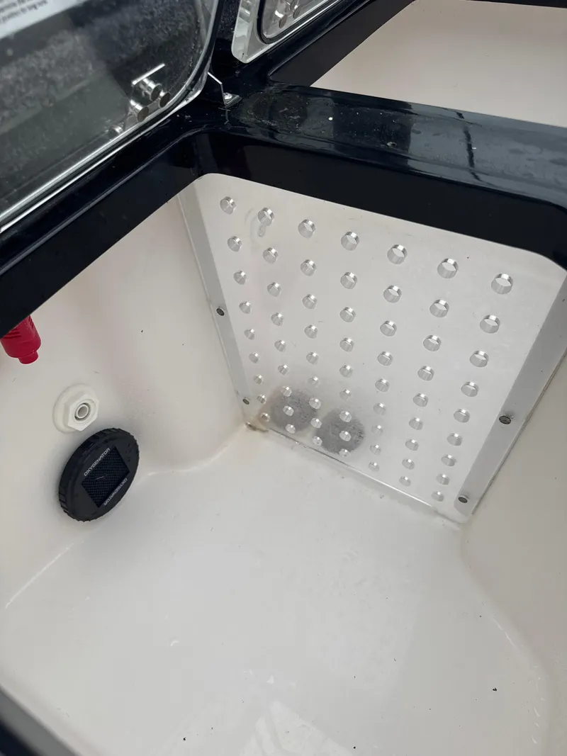 Slide: The Image of 2025 Vexus VXS20 boat compartment with drainage and ventilation features. - 35