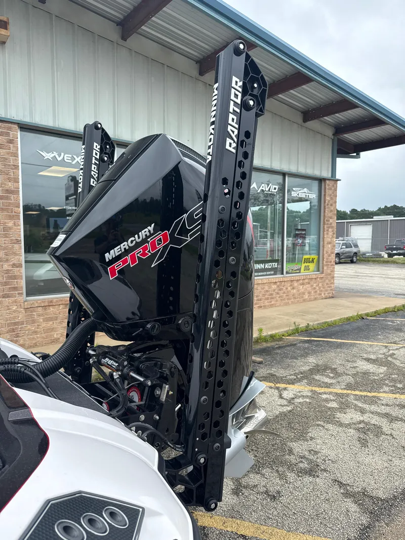 Slide: The Image of 2025 Vexus VXS20 with Mercury Pro XS engine and Raptor mount outside dealership. - 8