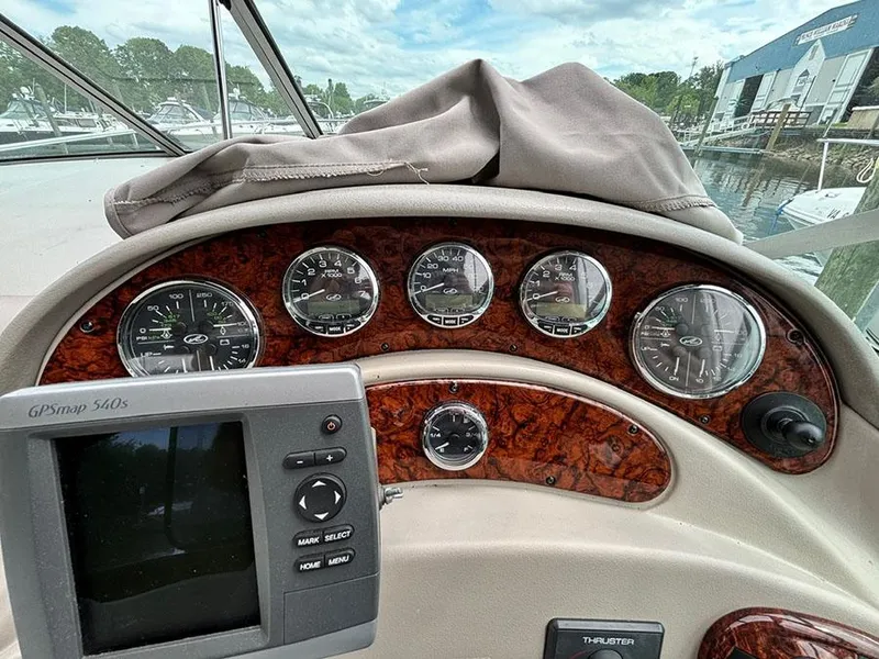 Slide: The Image of Dashboard of 2007 Sea Ray 280 Sundancer boat with gauges and GPS unit. - 12