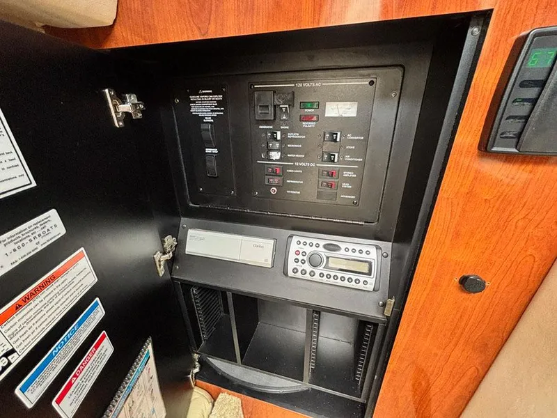 Slide: The Image of Electrical control panel inside a 2007 Sea Ray 280 Sundancer boat. - 19