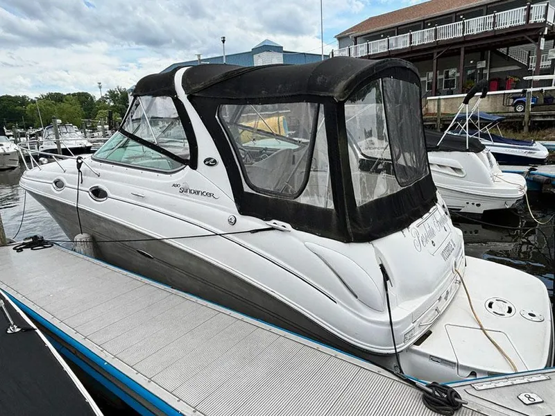 Slide: The Image of 2007 Sea Ray 280 Sundancer docked at marina with covered cabin. - 2