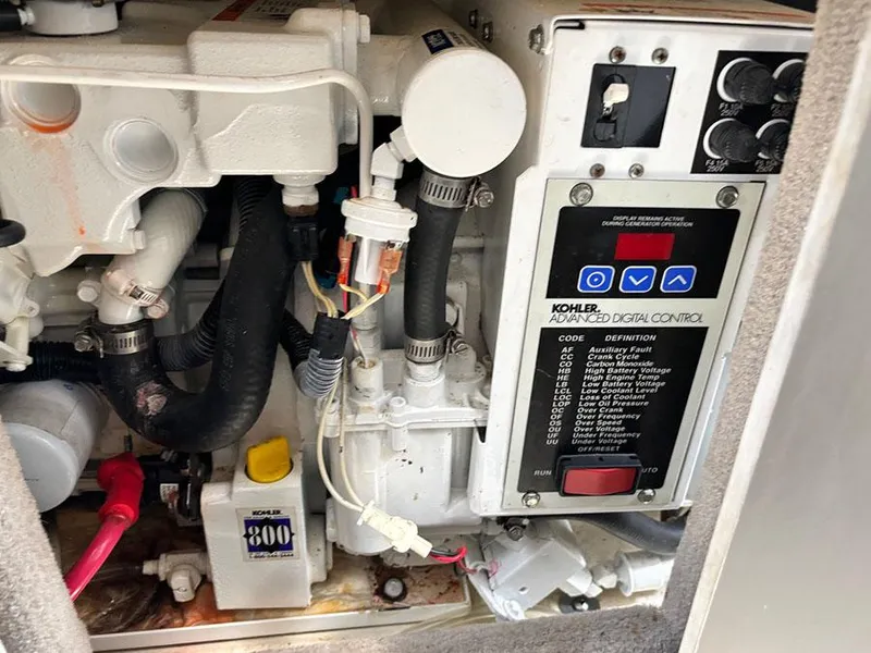 Slide: The Image of Engine compartment of 2007 Sea Ray 280 Sundancer with Kohler digital control panel. - 24