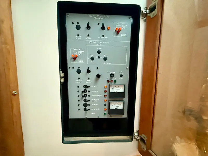 Slide: The Image of Electrical control panel on a 1989 Sea Ray 340 Sundancer boat. - 14