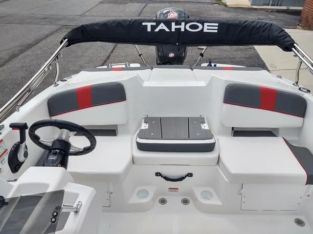 Slide: The Image of 2024 Tahoe T18 boat interior with seating and steering wheel, featuring modern design elements. - 5