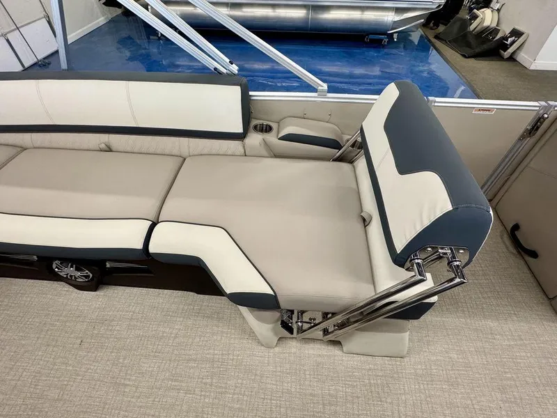 Slide: The Image of 2025 Tahoe Cascade 2385 QLS boat interior with adjustable seating and modern design. - 12