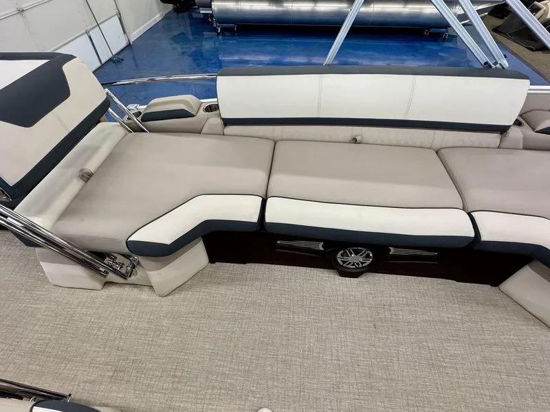 Slide: The Image of 2025 Tahoe Cascade 2385 QLS boat interior with luxurious seating and modern design. - 16