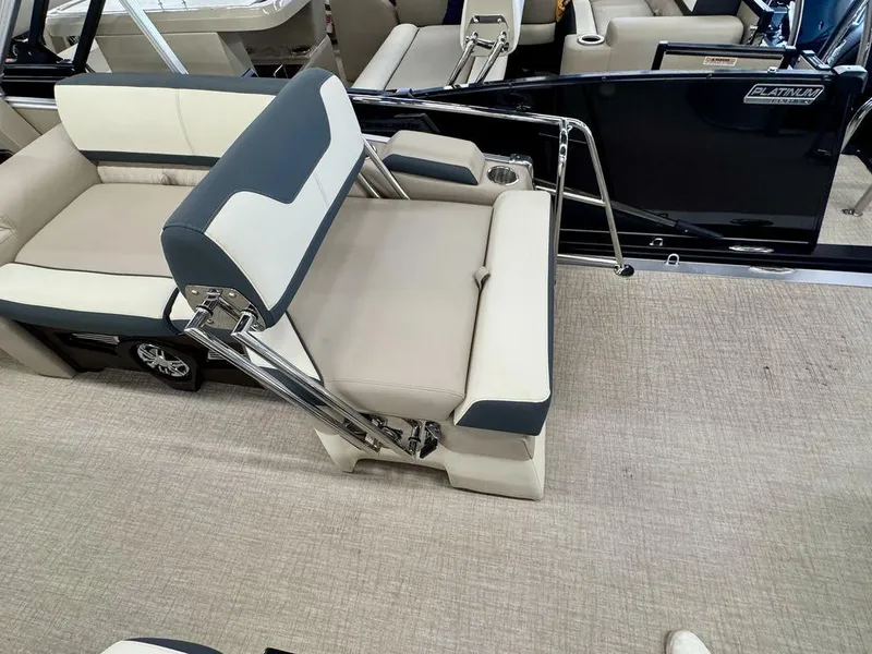 Slide: The Image of 2025 Tahoe Cascade 2385 QLS boat interior with adjustable seating and modern design. - 17