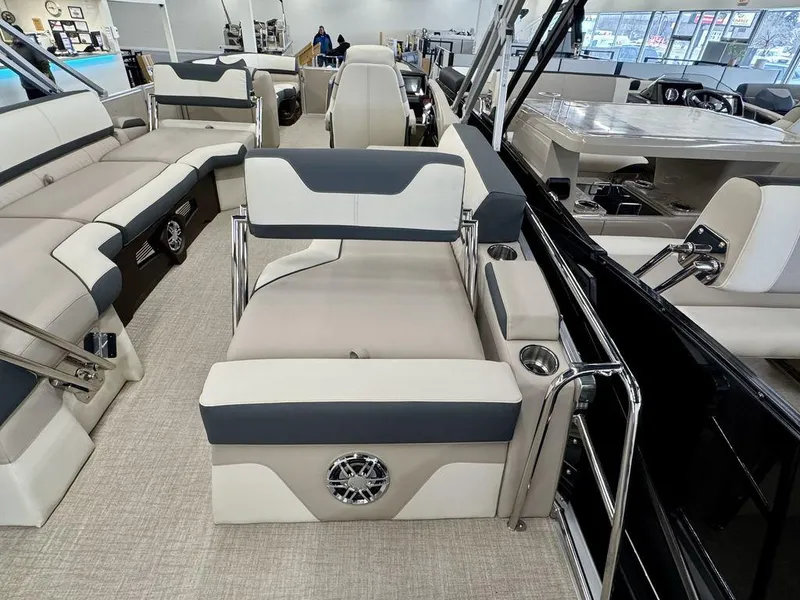 Slide: The Image of 2025 Tahoe Cascade 2385 QLS boat interior with luxurious seating and modern design. - 18