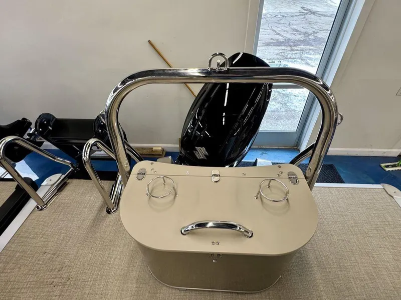 Slide: The Image of 2025 Tahoe Cascade 2385 QLS boat interior with stainless steel railings and cup holders. - 19