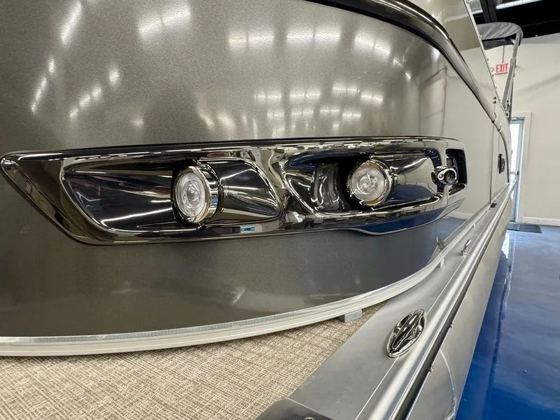 Slide: The Image of 2025 Tahoe Cascade 2385 QLS boat with sleek metallic finish and modern lighting. - 4