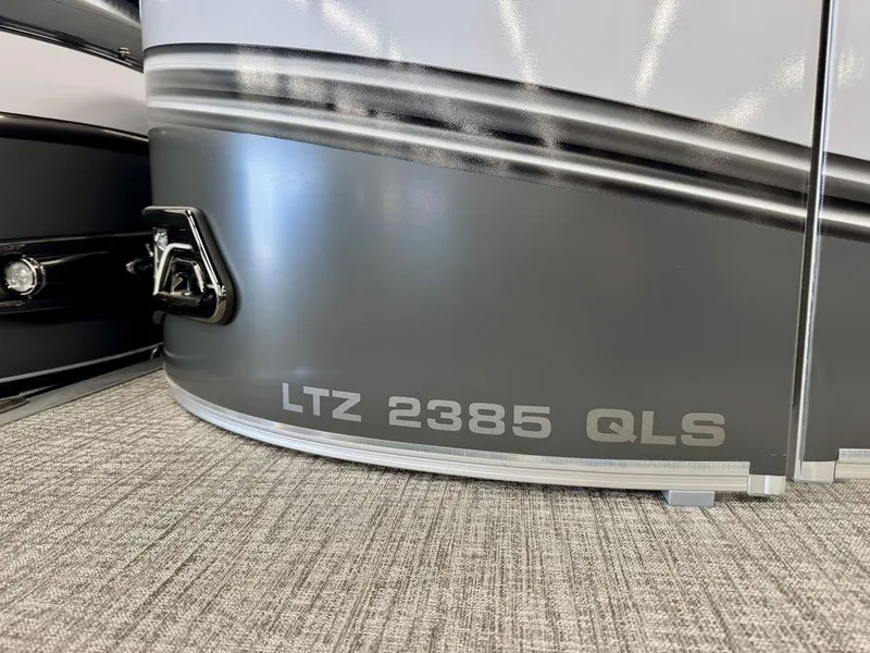Slide: The Image of 2025 Tahoe LTZ 2385 QLS boat detail with sleek gray finish. - 11