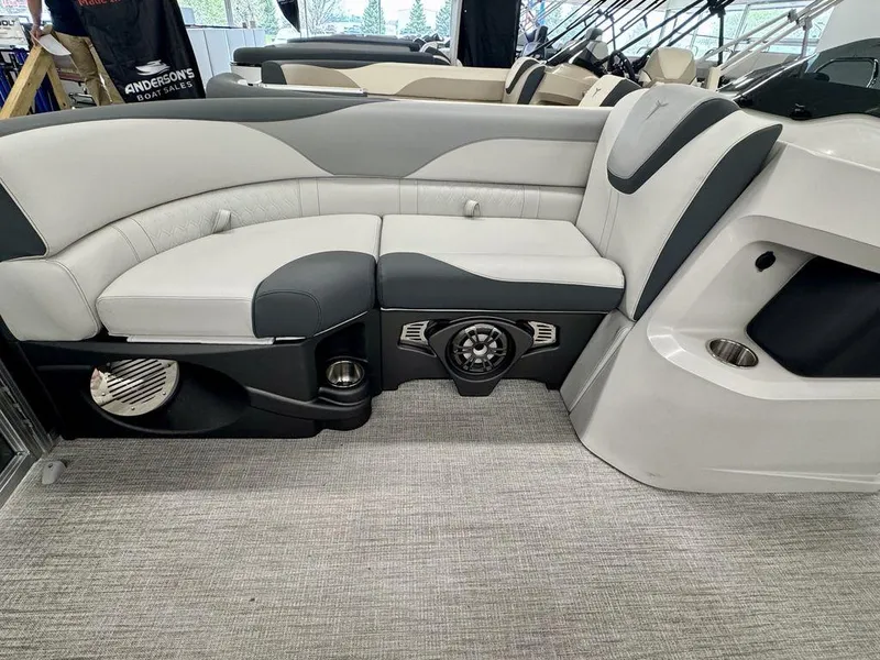 Slide: The Image of Luxurious seating on 2025 Tahoe LTZ 2385 QLS boat, featuring modern design and integrated speakers. - 12