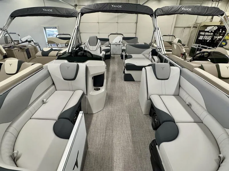 Slide: The Image of 2025 Tahoe LTZ 2385 QLS pontoon boat interior with luxurious seating and modern design. - 2