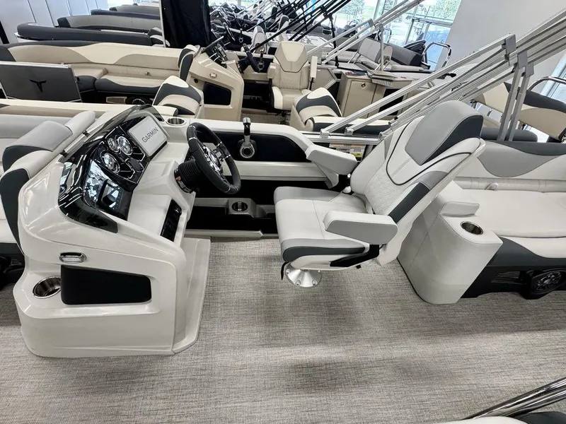 Slide: The Image of 2025 Tahoe LTZ 2385 QLS boat interior with modern helm and luxurious seating. - 4