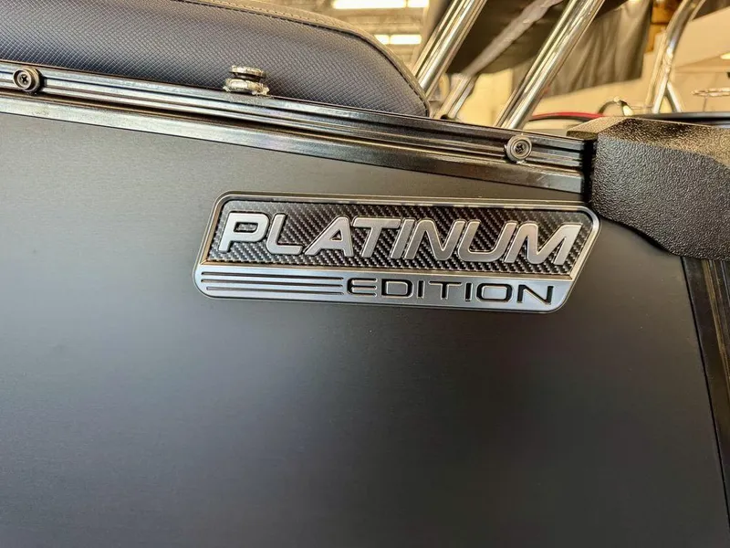 Slide: The Image of 2025 Tahoe Cascade 2585 QLS Platinum Edition badge on sleek black surface. - 5