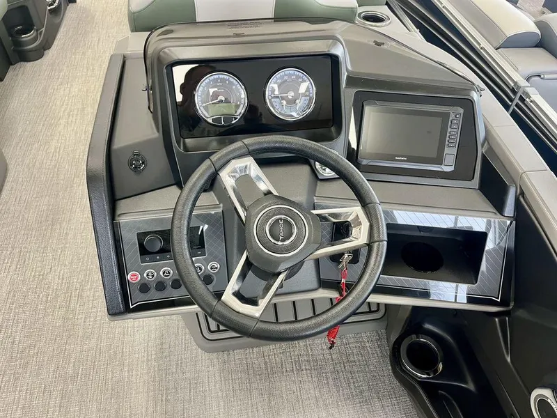 Slide: The Image of Steering console of 2025 Tahoe Cascade 2385 VRB with modern gauges and controls. - 10