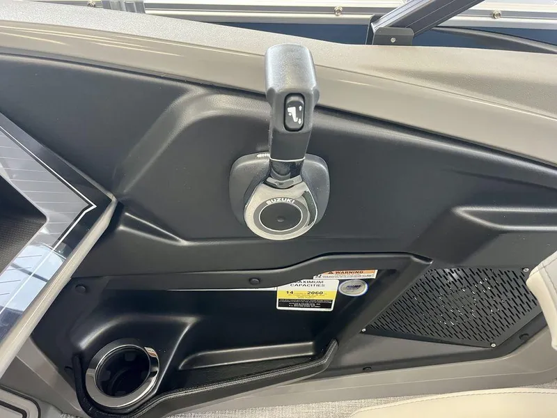 Slide: The Image of Throttle control panel of 2025 Tahoe Cascade 2385 VRB boat, featuring Suzuki controls. - 11