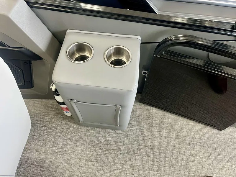 Slide: The Image of Cup holders and storage on 2025 Tahoe Cascade 2385 VRB boat interior. - 13