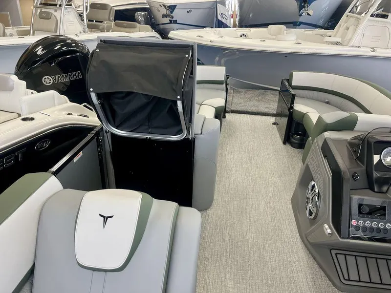 Slide: The Image of 2025 Tahoe Cascade 2385 VRB interior with Yamaha engine, featuring modern seating and dashboard. - 19