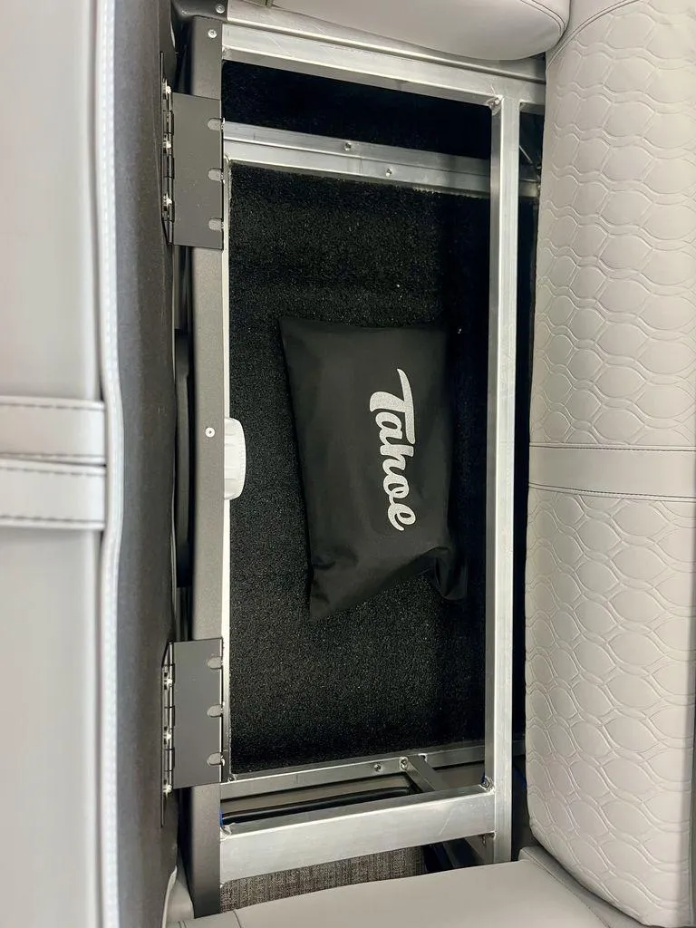 Slide: The Image of Under-seat storage in 2025 Tahoe Cascade 2385 VRB with Tahoe-branded bag. - 20