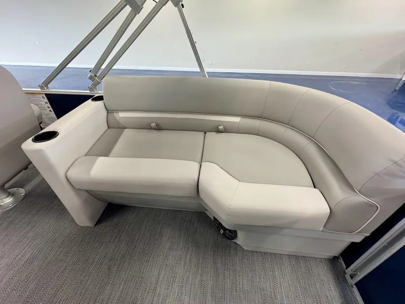 Slide: The Image of Luxurious seating on 2025 Godfrey EX 2286 SBX pontoon boat, featuring plush gray upholstery. - 11