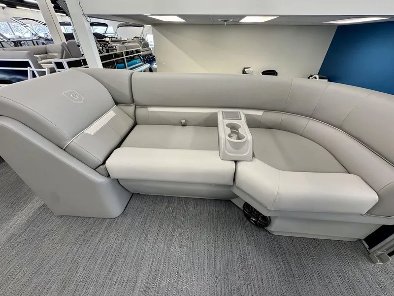 Slide: The Image of Luxurious seating on 2025 Godfrey EX 2286 SBX pontoon boat, featuring sleek gray upholstery. - 7