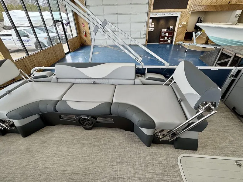 Slide: The Image of 2025 Tahoe LTZ 2385 QLS pontoon boat interior with gray seating and modern design. - 12