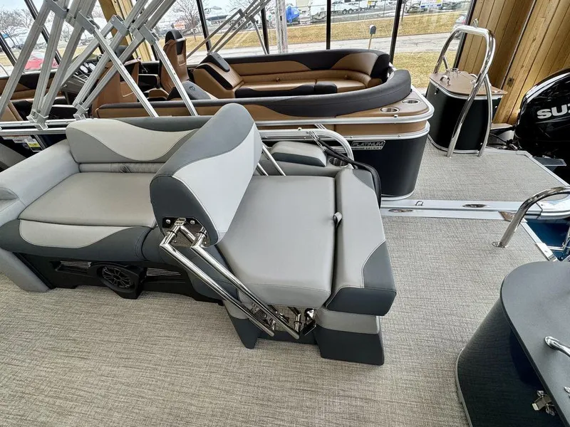 Slide: The Image of 2025 Tahoe LTZ 2385 QLS pontoon boat interior with luxurious seating and modern design. - 14