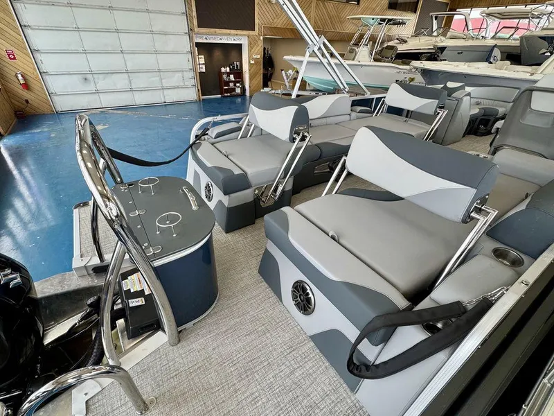 Slide: The Image of 2025 Tahoe LTZ 2385 QLS pontoon boat interior with modern seating and sleek design. - 15