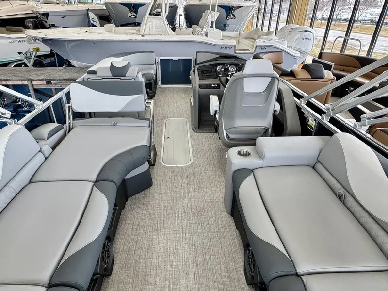 Slide: The Image of 2025 Tahoe LTZ 2385 QLS pontoon boat interior with luxurious seating and modern design. - 16