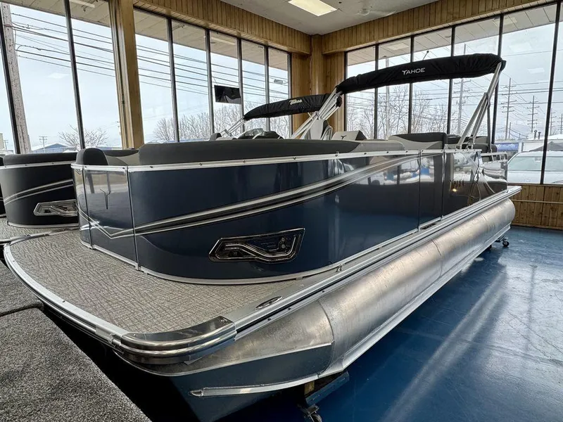 Slide: The Image of 2025 Tahoe LTZ 2385 QLS pontoon boat displayed indoors, showcasing sleek design and modern features. - 5