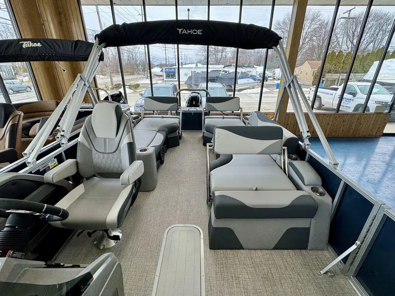 Slide: The Image of 2025 Tahoe LTZ 2385 QLS pontoon boat interior with plush seating and modern design. - 9