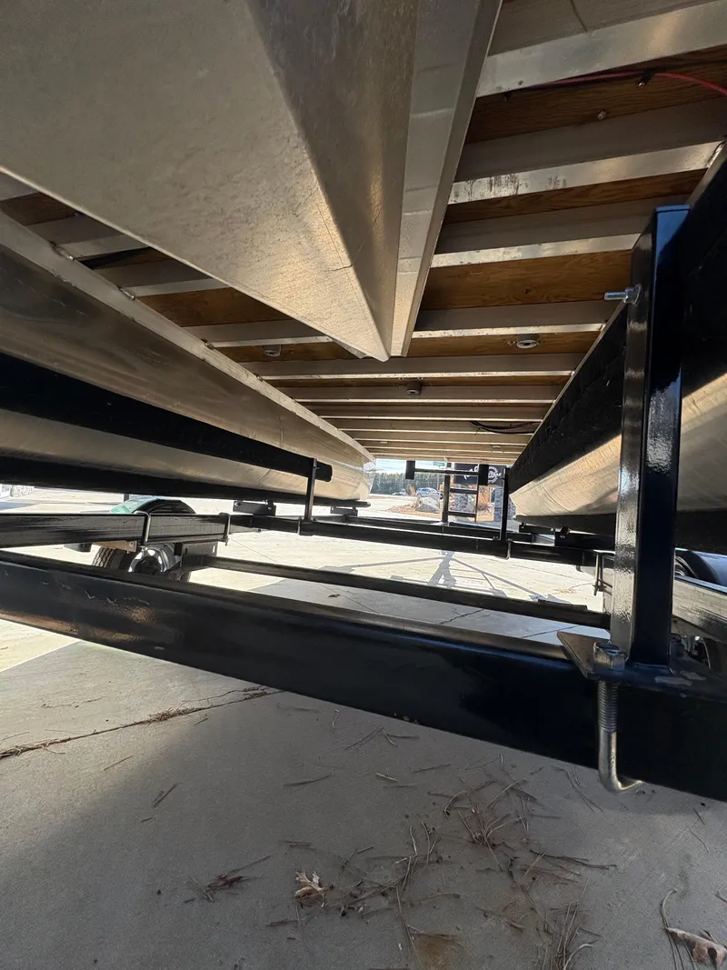Slide: The Image of Underneath view of 2025 Custom Maui 16 Fisherman boat on trailer. - 10
