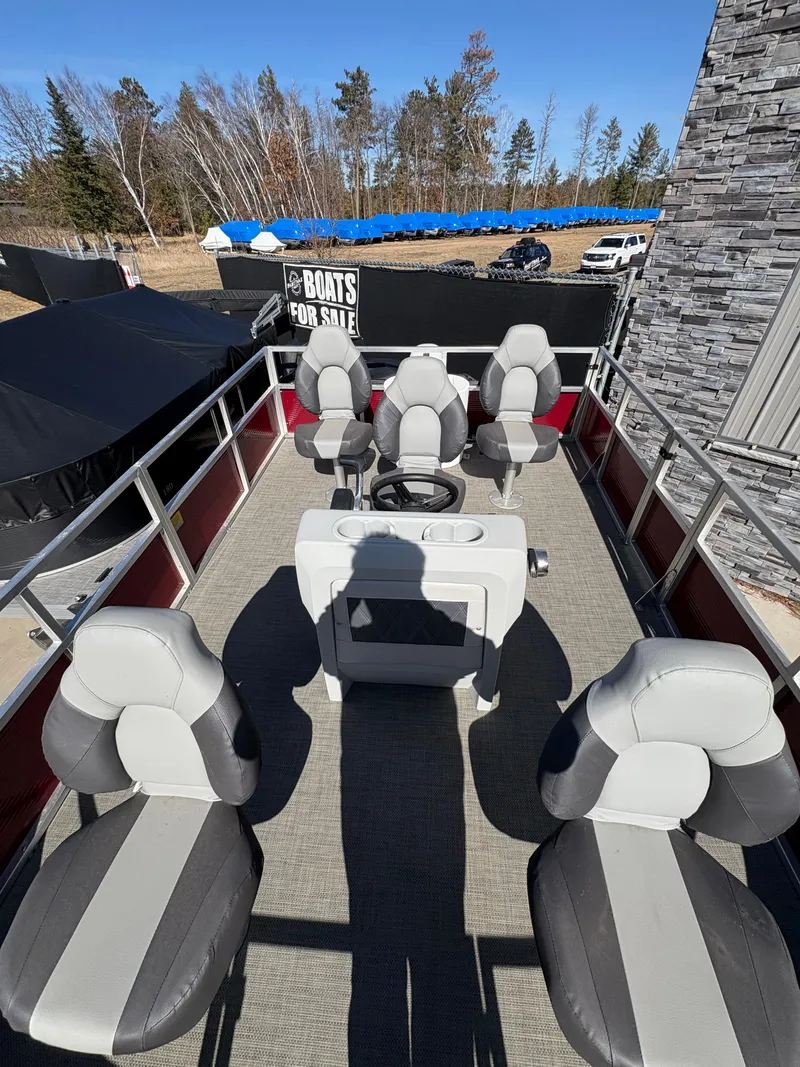 Slide: The Image of 2025 Custom Maui 16 Fisherman boat interior with seating and steering console. - 11