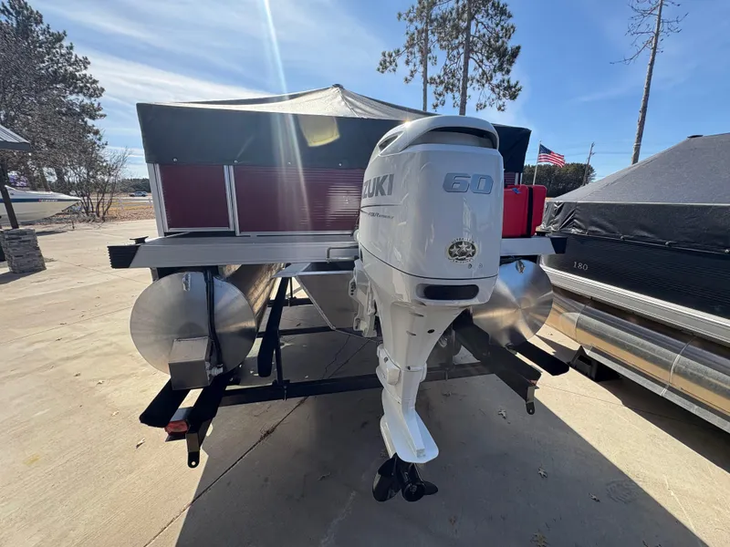 Slide: The Image of Custom Maui 16 Fisherman 2025 boat with Suzuki 60 engine on trailer. - 5